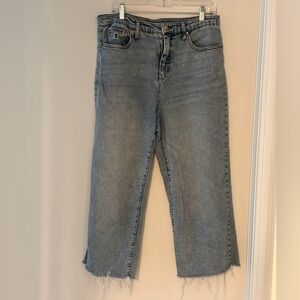 Light wash straight leg jeans with raw hem